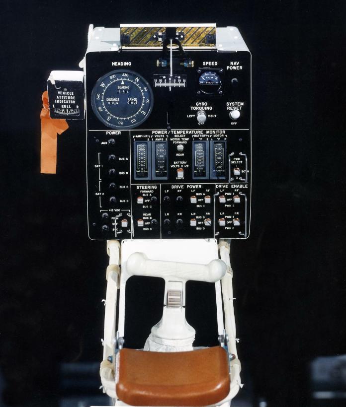 The Lunar Roving Vehicle's control console and the white hand controller beneath it. While the control console gave speed and directional readins and allowed astronauts to adjust power settings, the hand controller handled acceleration, braking, and steering.