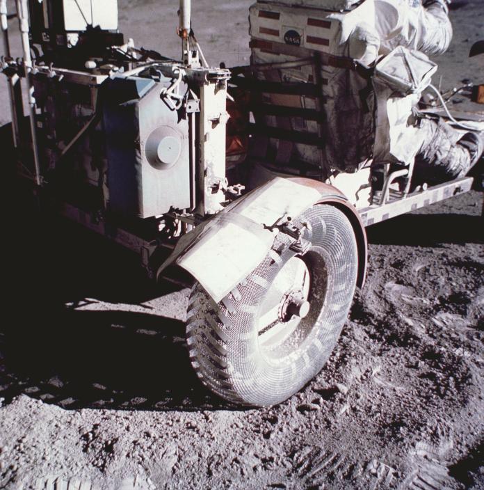 A makeshift solution for a broken fender on the back of the Apollo 17 Lunar Roving Vehicle. Astronaut Eugene Cernan accidentally broke the fender with a hammer.