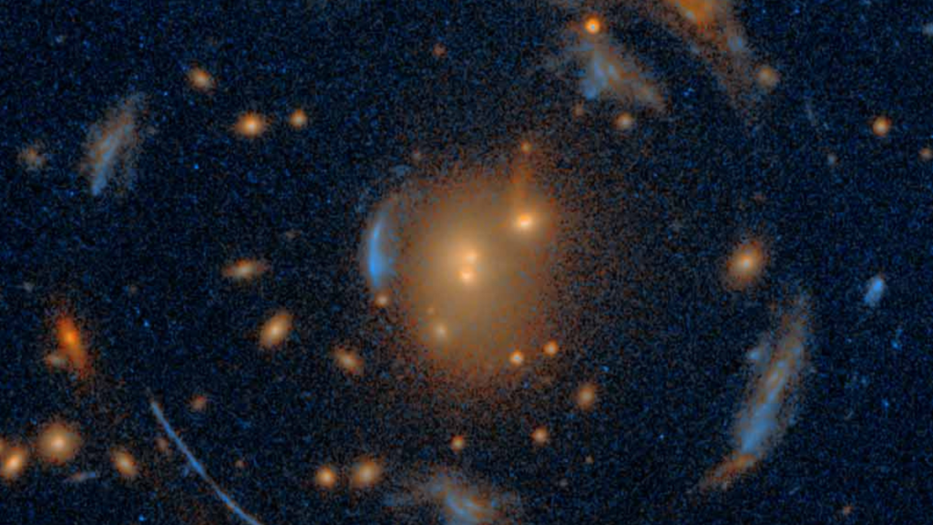 The largest Einstein Cross ever discovered dwells among a rare ‘carousel’ of galaxies_66f175b201455.png