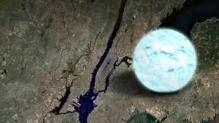 A glowong blue sphere against a muddy brown scarred and cracked landscape