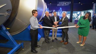 Jeff Siders, HALO (Habitation and Logistics Outpost) program and business development manager at Northrop Grumman; president and CEO of Space Center Houston William Harris; and Sean Fuller, international partner manager for the Gateway program at NASA cut a ribbon ceremonially opening the lunar habitat exhibit at Space Center Houston on Oct. 23, 2024.