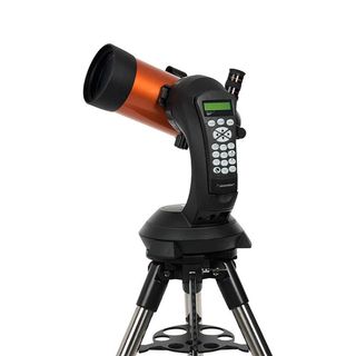 Celestron NexStar 4SE telescope on a white background