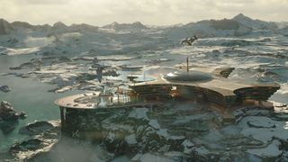 An ornate sci-fi building on top of a mountain.