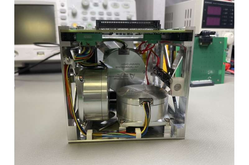 The ADCS box with reaction wheels before installation in the satellite. The reaction wheels are used for attitude control in space. Credit: Tom Baumann / JMU Würzburg AI controls satellite