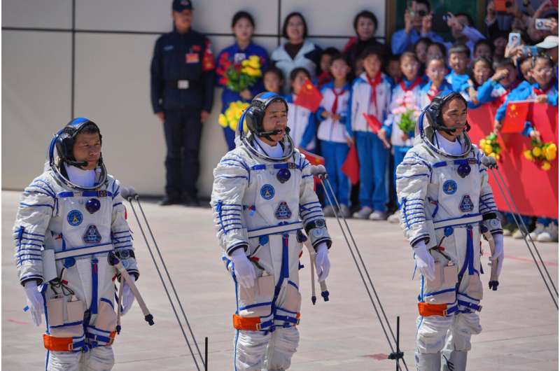 China's stranded astronauts 'in good condition' after space debris delays planned return