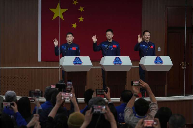China's stranded astronauts 'in good condition' after space debris delays planned return