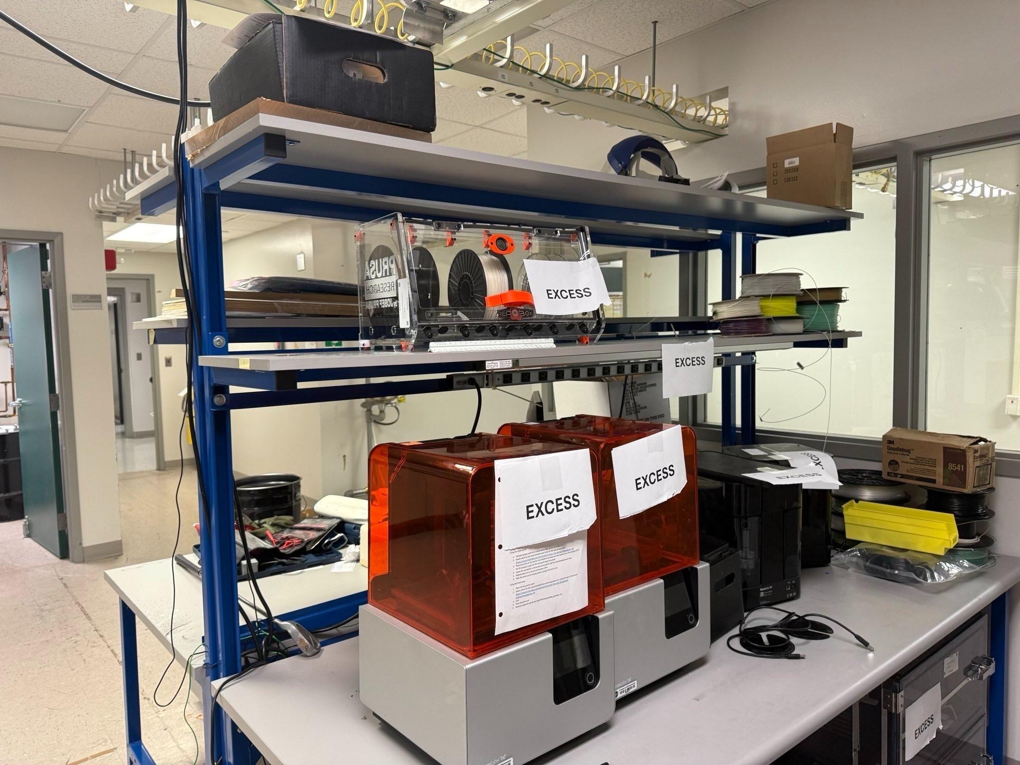 Various office spaces including desks, shelves and warehouses full of items stacked ready to be removed.