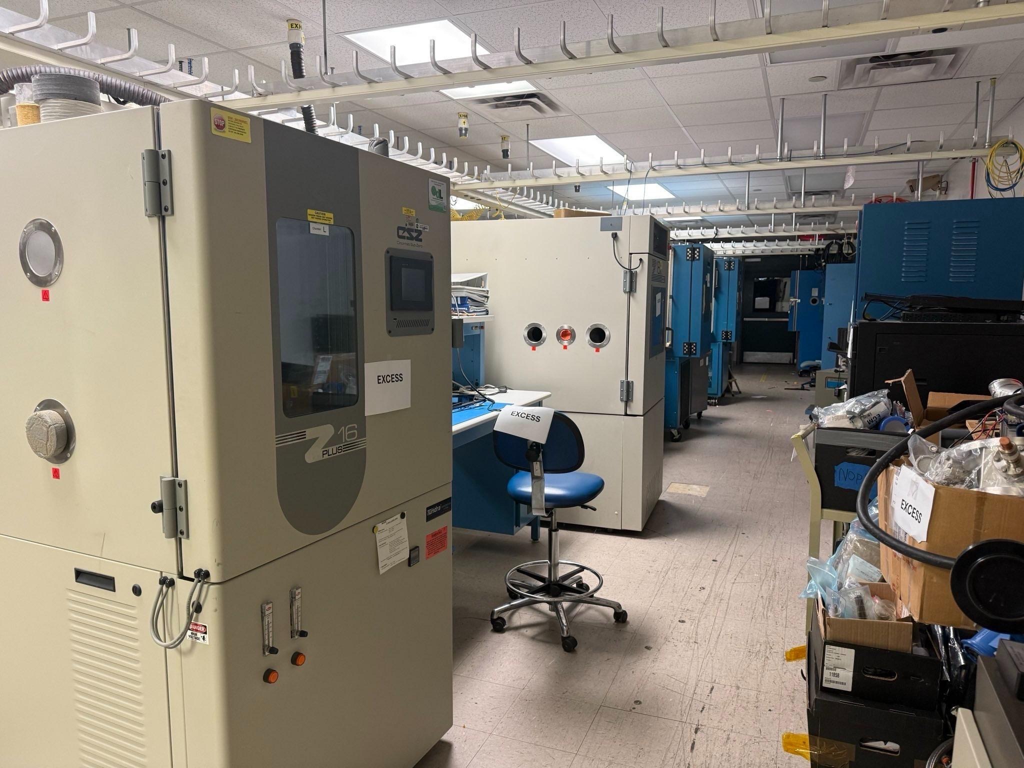 Large equipment sits abandoned in a laboratory.