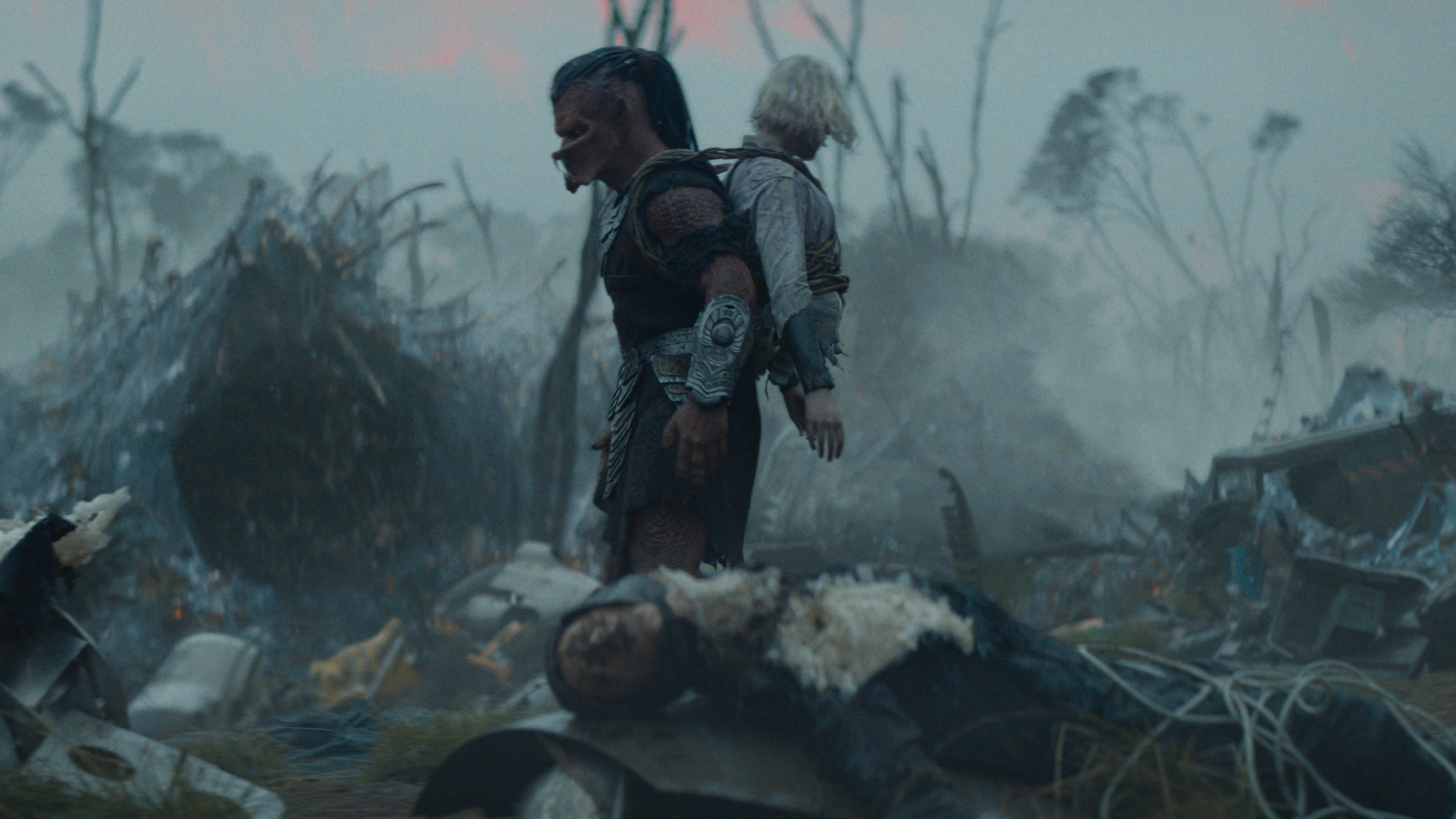 (L-R) Dek (Dimitrius Schuster-Koloamatangi) and Thia (Elle Fanning) in 20th Century Studios' PREDATOR: BADLANDS film. Photo courtesy of 20th Century Studios. © 2025 20th Century Studios. All Rights Reserved.