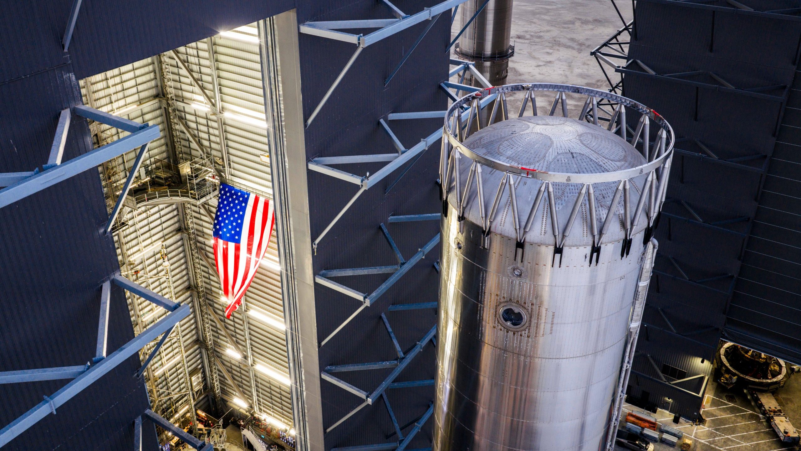 A giant chrome cylinder fashioned into a rocket booster