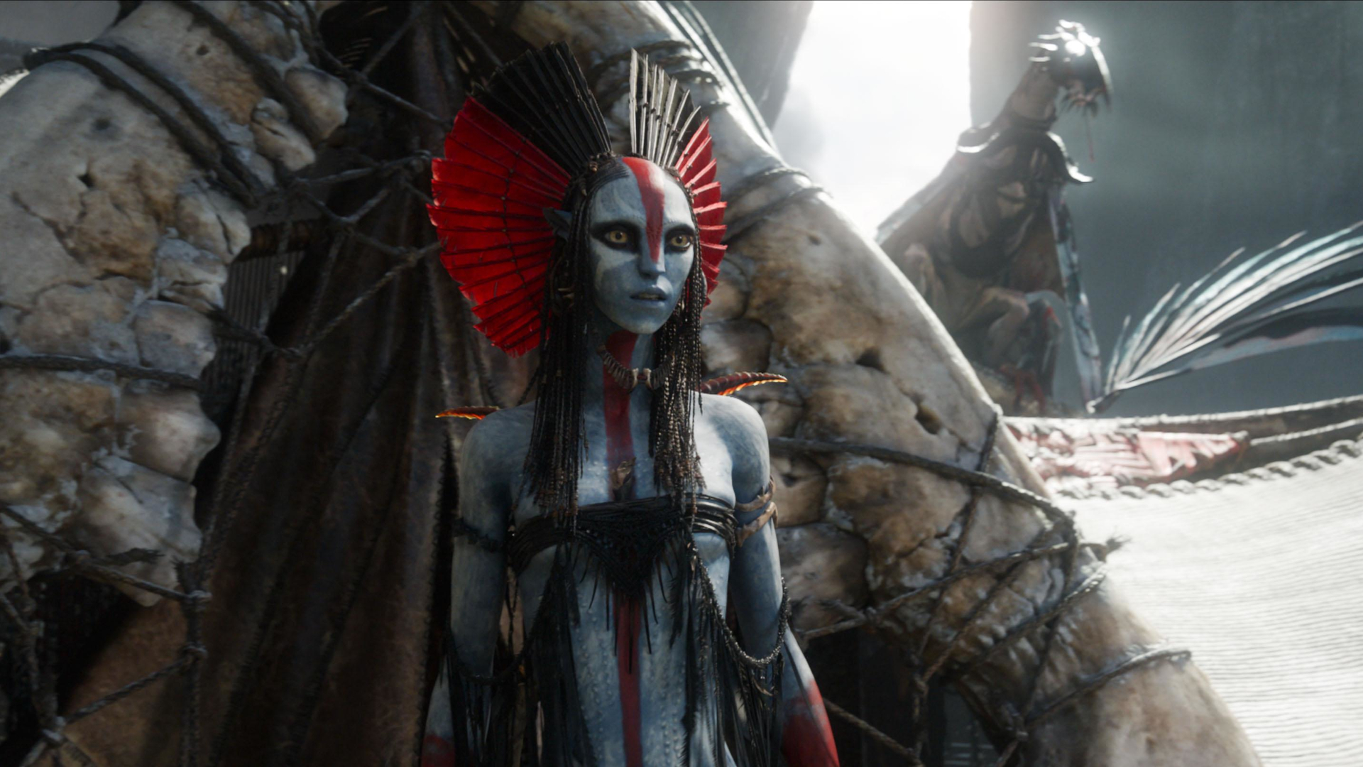 Oona Chaplin as a female Navi warrior, seen on the beach near a flying creature in Avatar: Fire & Ash