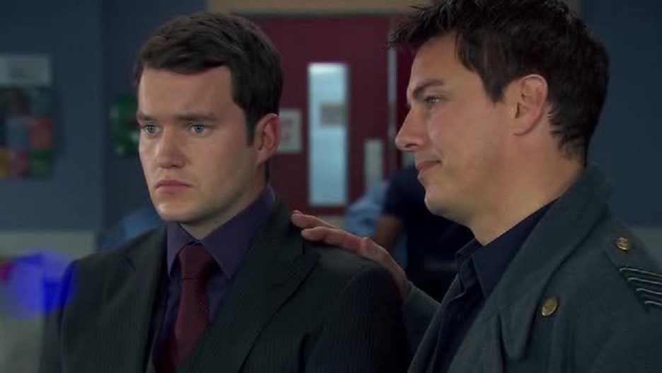Screenshot from the 2009 mini-series Torchwood: Children of Earth showing Ianto Jones and Captain Jack Harkness.