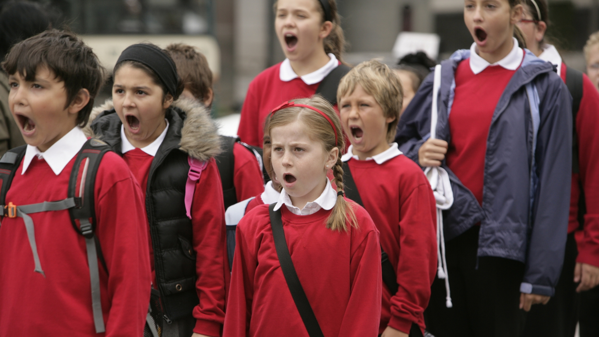 Screenshot from the 2009 mini-series Torchwood: Children of Earth showing a group of school children all speaking in unison.
