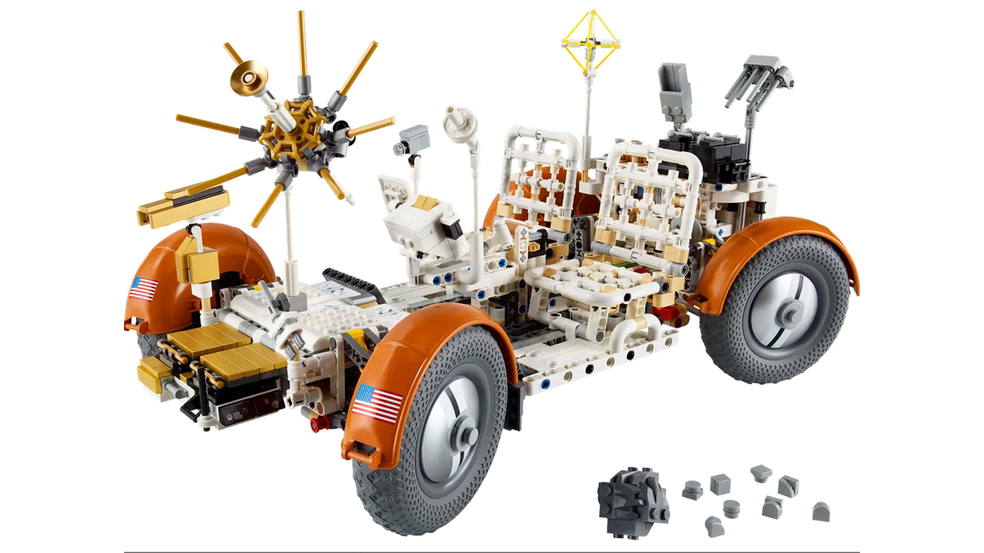 A Lego Lunar Rover, with plastic moon rock next to it.