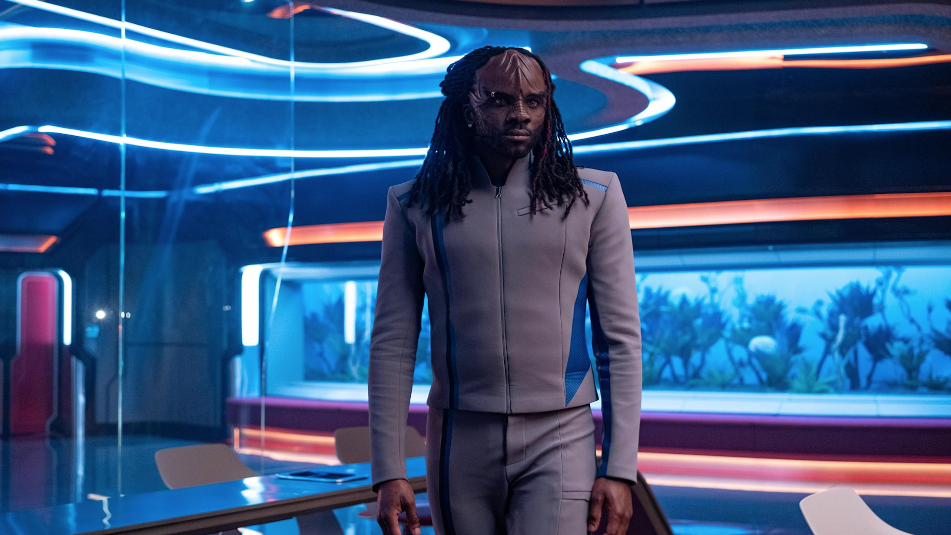 an alien man on a futuristic starship