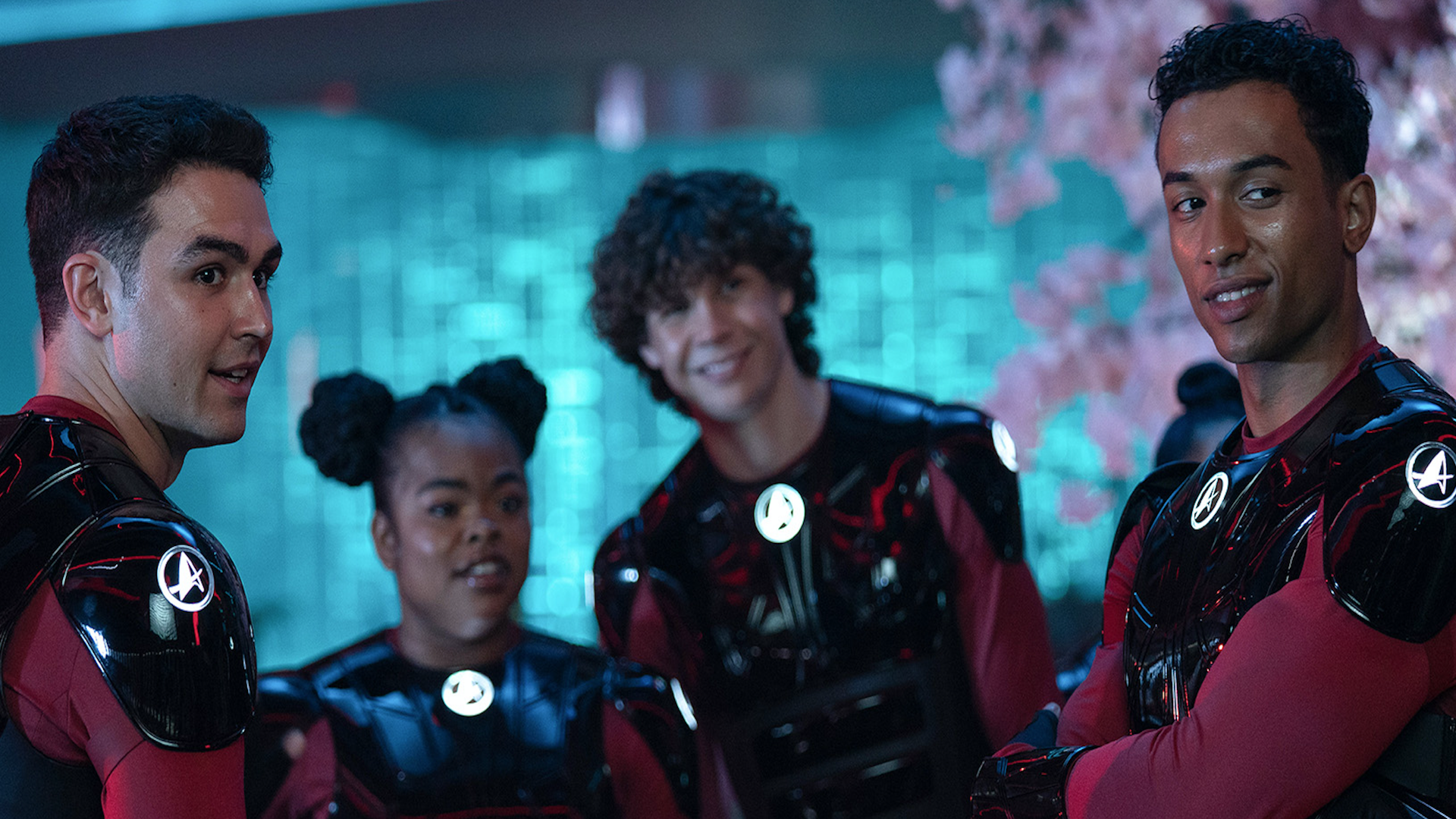 a group of sci-fi cadets in red and black outfits