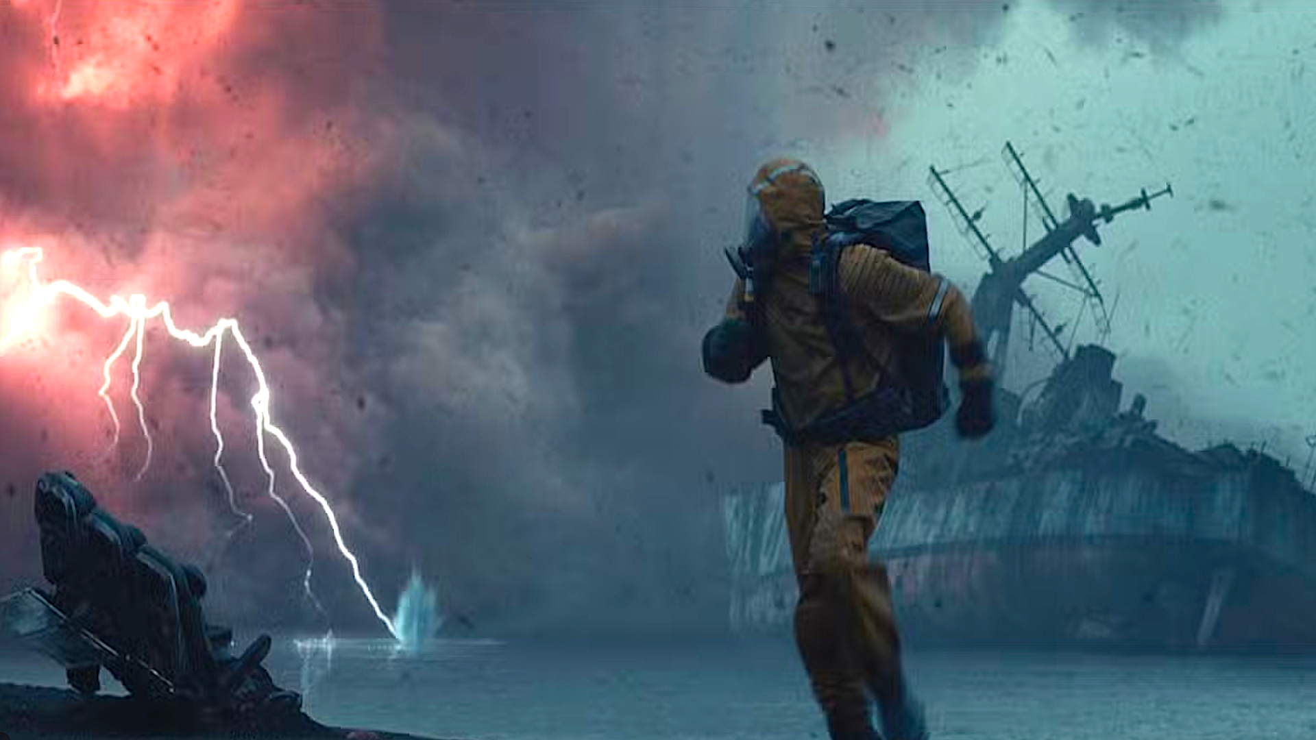 A man in a HAZMAT suit running from a lightning storm