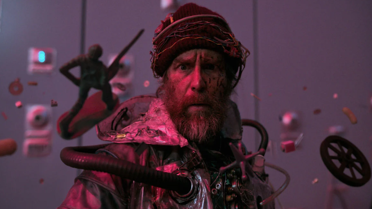 a weird bearded man with objects frozen in time