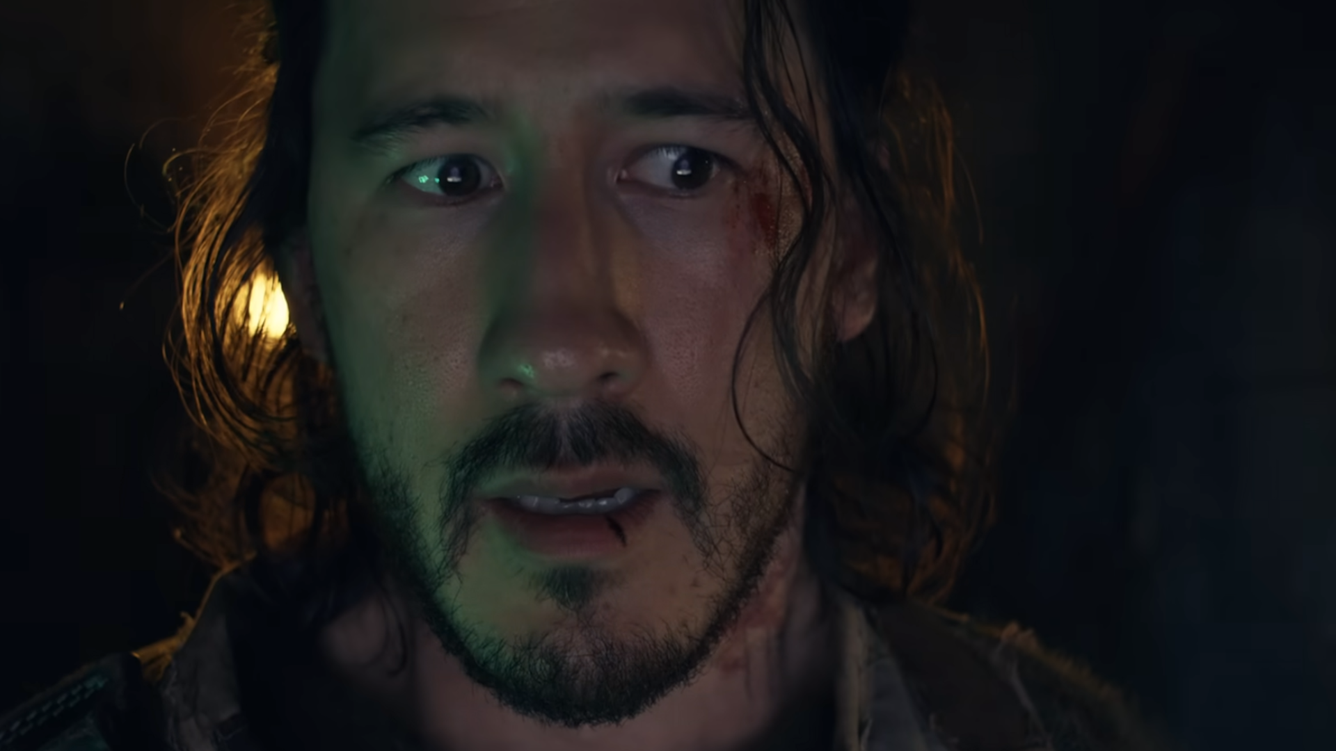 a frightened man inside a claustrophobic sub