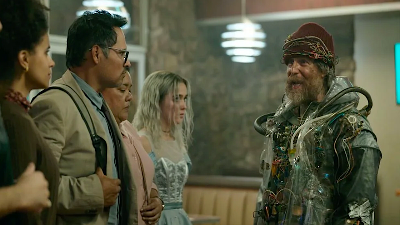 A crazy futuristic man talking to people in a diner