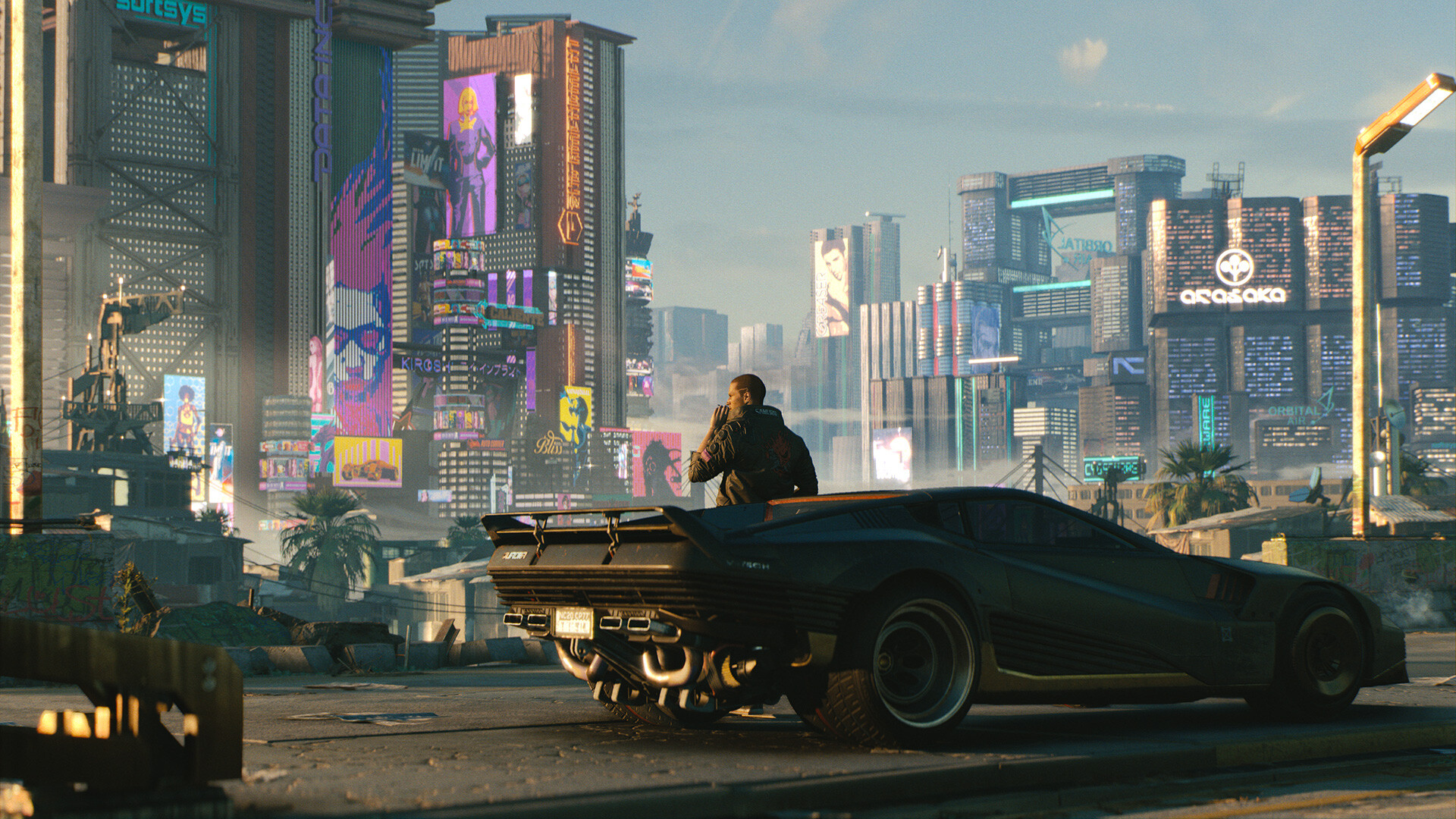 Promotional art for Cyberpunk 2077 showing V sitting against a futuristic car, looking out over Night City.