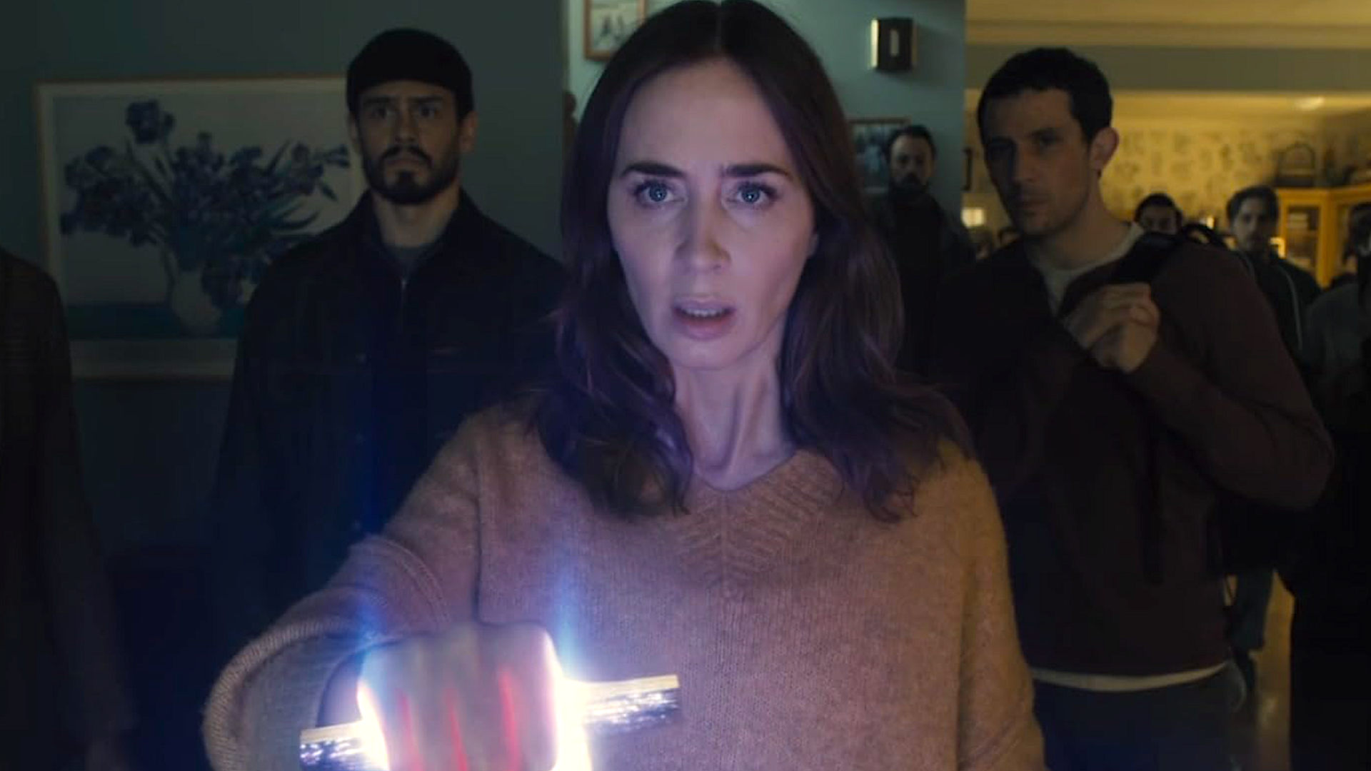 a frightened woman holding a glowing silver stick