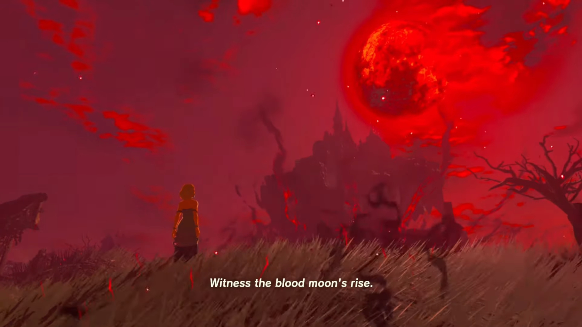 The Blood Moon shown in a red sky in The Legend of Zelda: Breath of the Wild. The text 