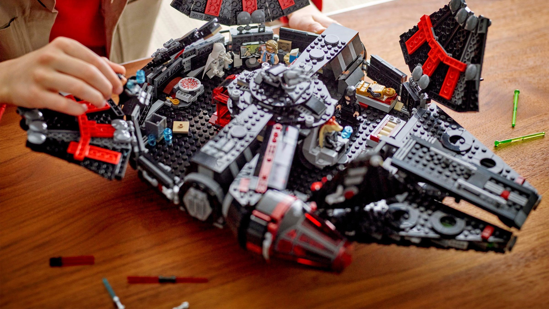 The Lego Star Wars Dark Falcon, open, revealing various figures and locations.