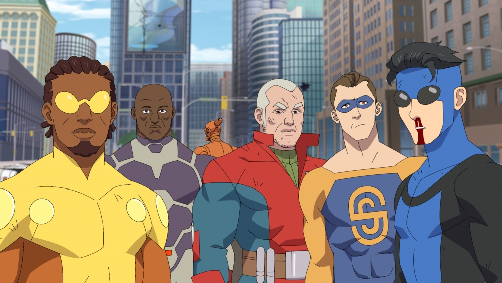 a group of five animated superheroes in a big city