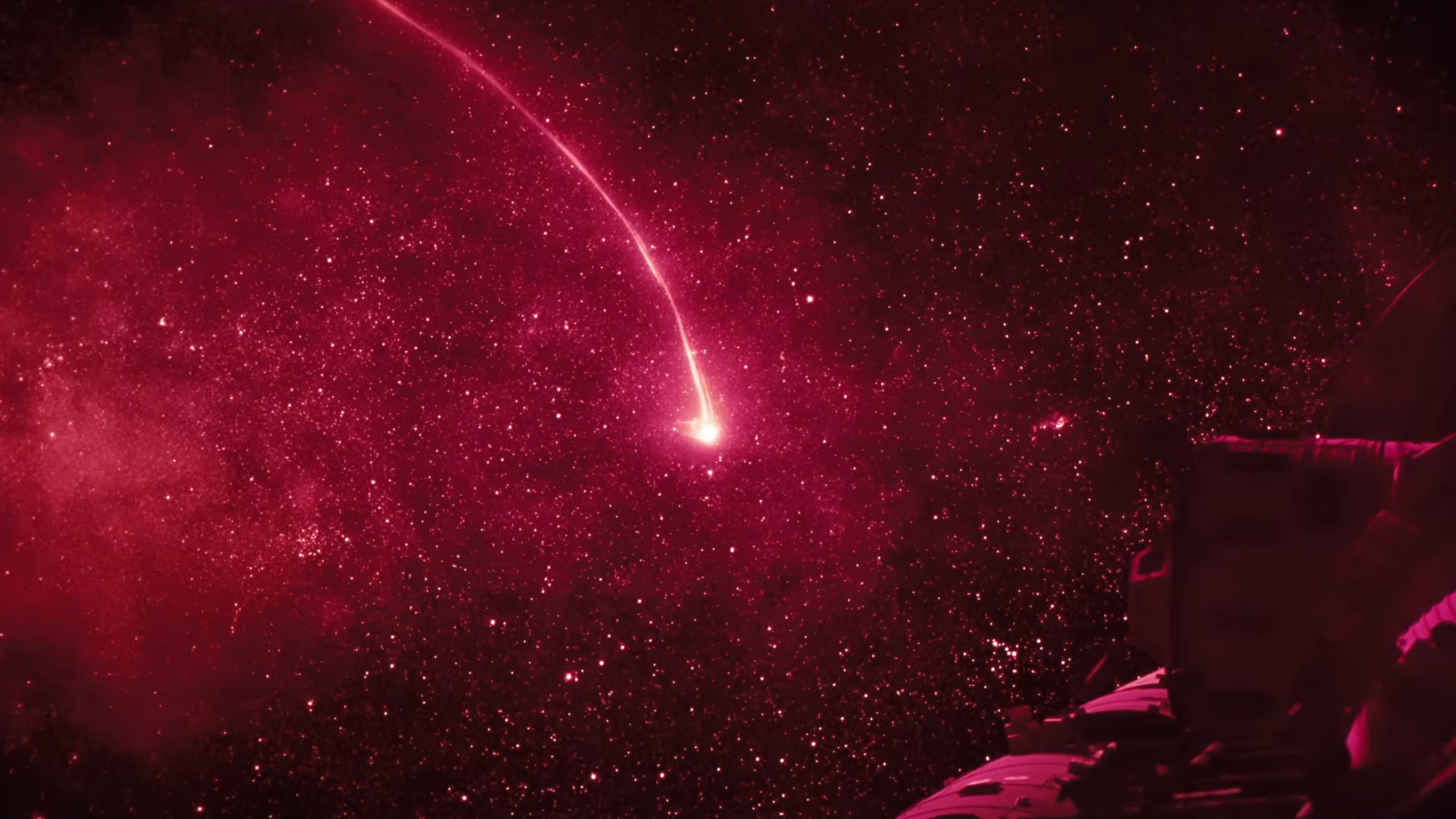 A pinkish-red line extending out from a star in space, shown in the movie Project Hail Mary.
