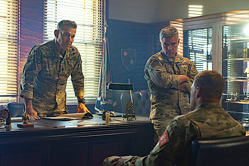 three Army Ranger soldiers in an office