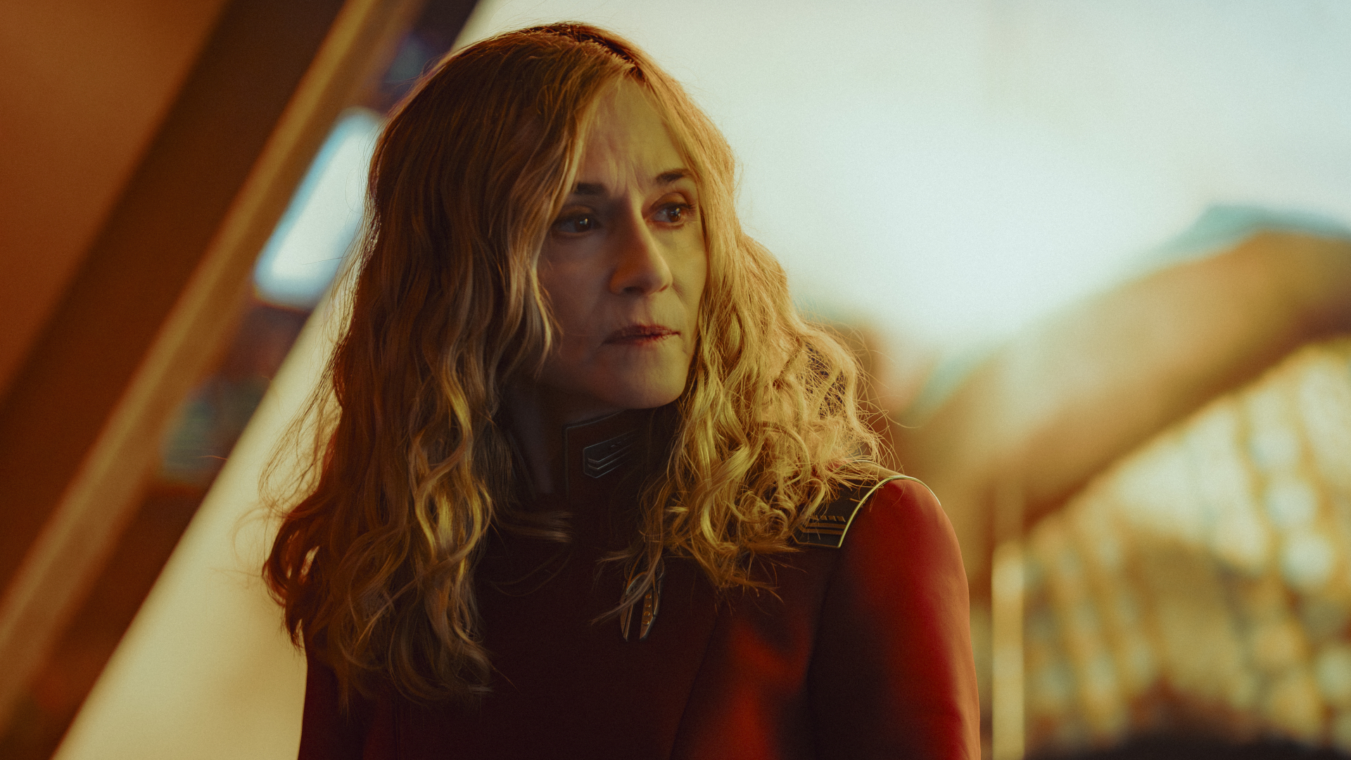 people in futuristic clothing in a brightly lit room