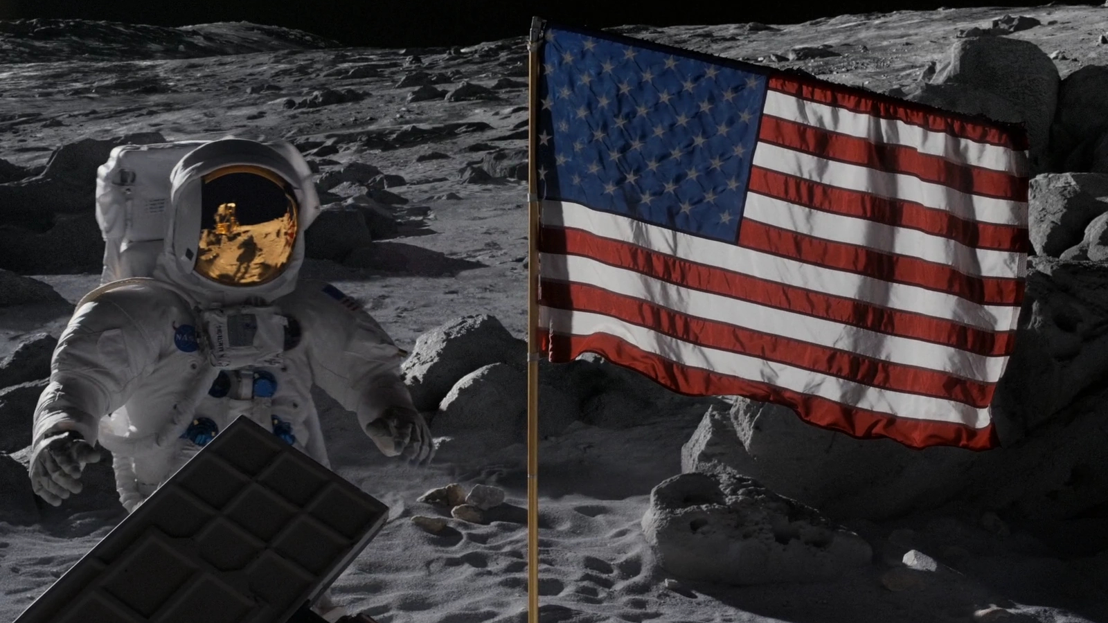 Screenshot showing a NASA astronaut on the moon, next to the American flag, in the show For All Mankind