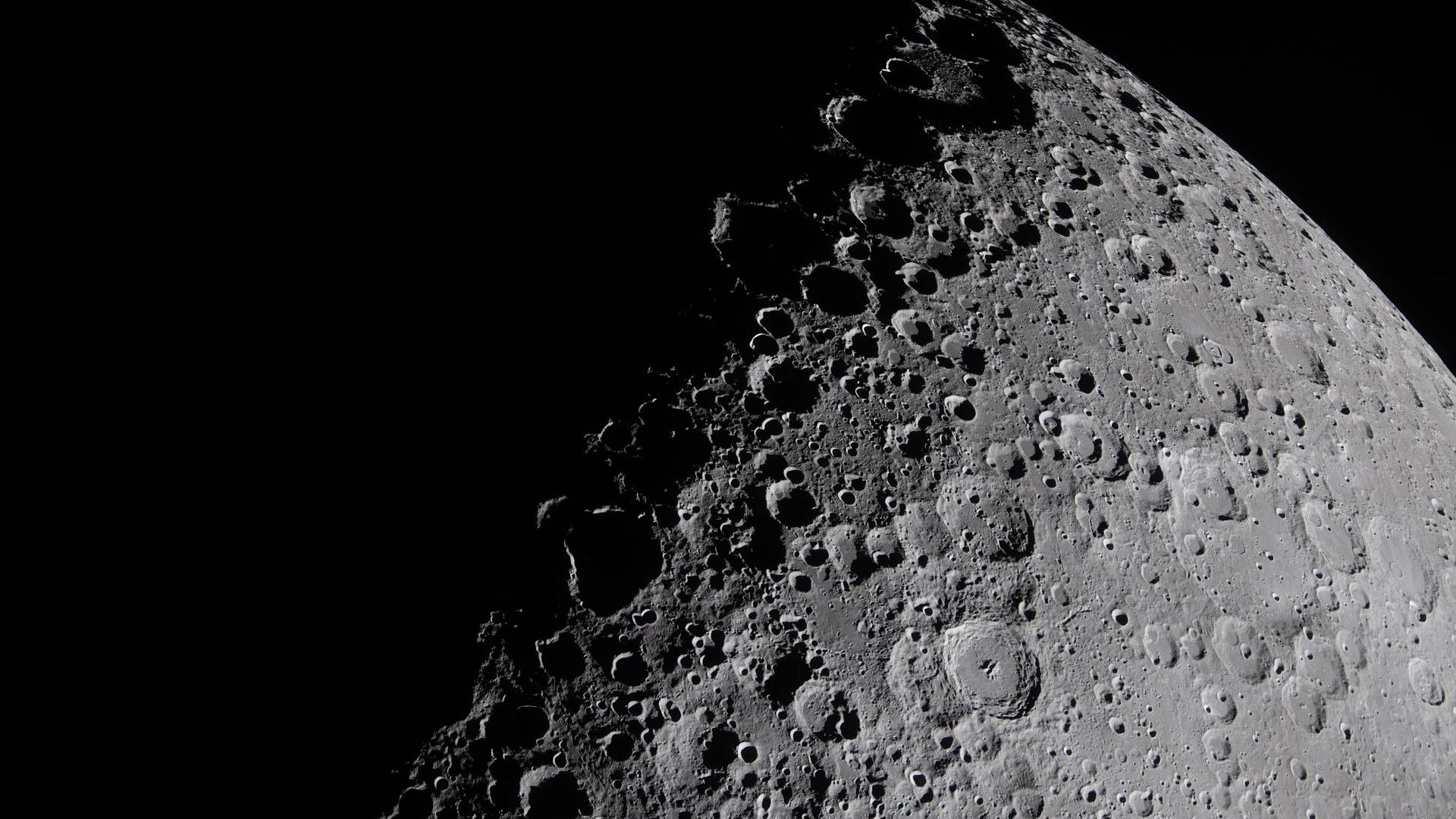 The Artemis 2 crew captured a portion of the Moon coming into view along the terminator – the boundary between lunar day and night – where low-angle sunlight casts long, dramatic shadows across the surface