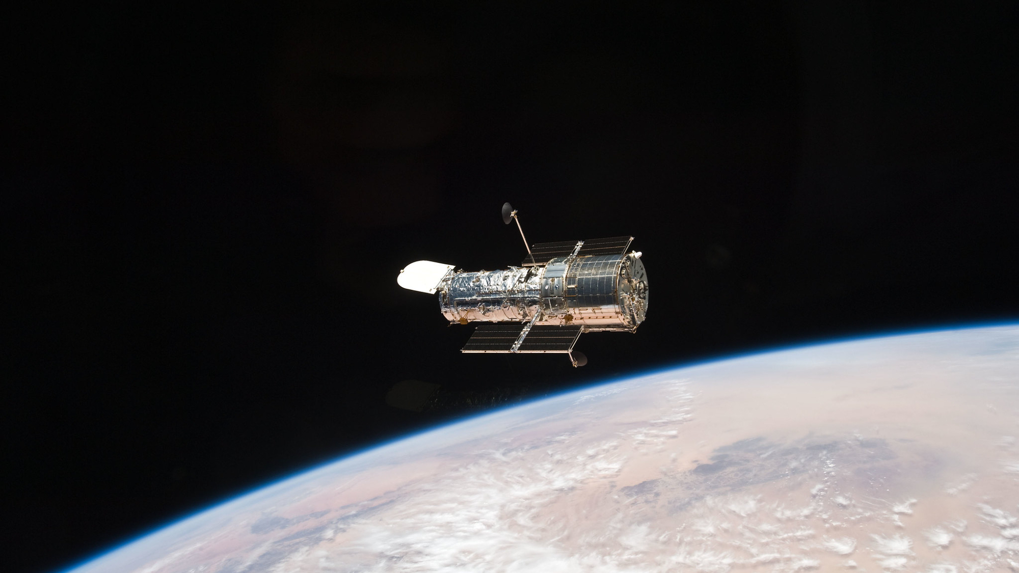 An STS-125 crew member aboard the Space Shuttle Atlantis captured this still image of the Hubble Space Telescope as the two spacecraft continued their relative separation on May 19, 2009, after having been linked together for the better part of a week.