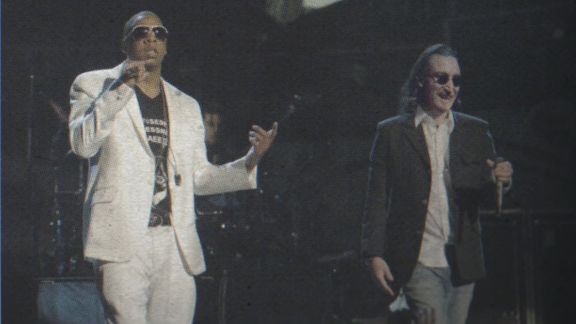 Jay Z and John Lennon performing a fictional concert in sci-fi show 