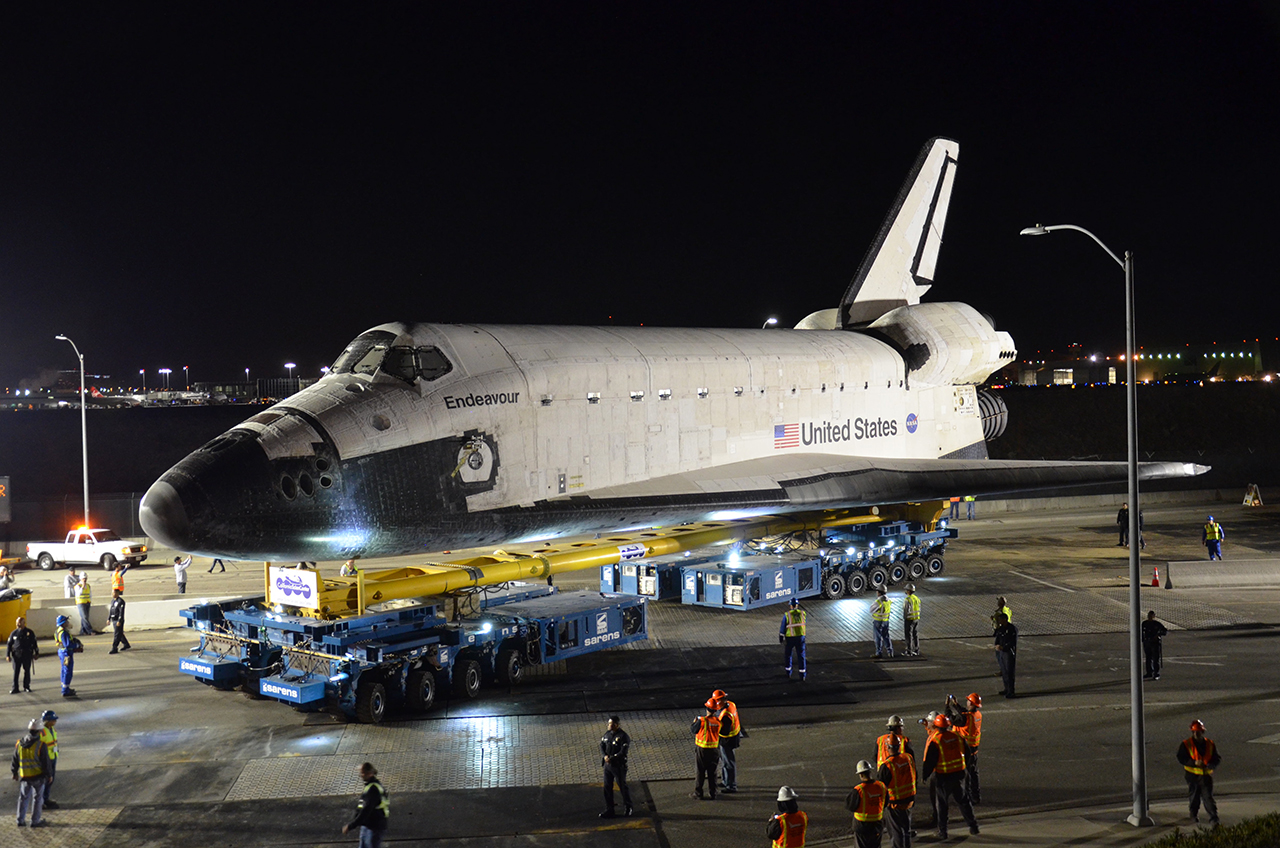 Space shuttle Endeavour on top of the overland transporter beginning its two-day, 12-mile L.A. road trip from Los Angeles International Airport to the California Science Center in the city on Oct. 12, 2012.