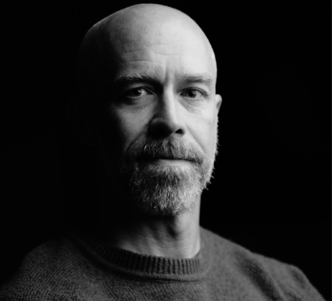 a black-and-white image of a male book author